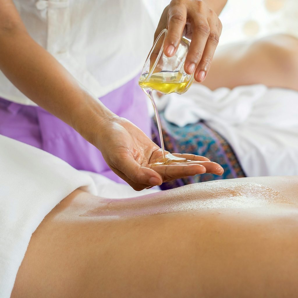 Massage oil during a back, neck and shoulder massage